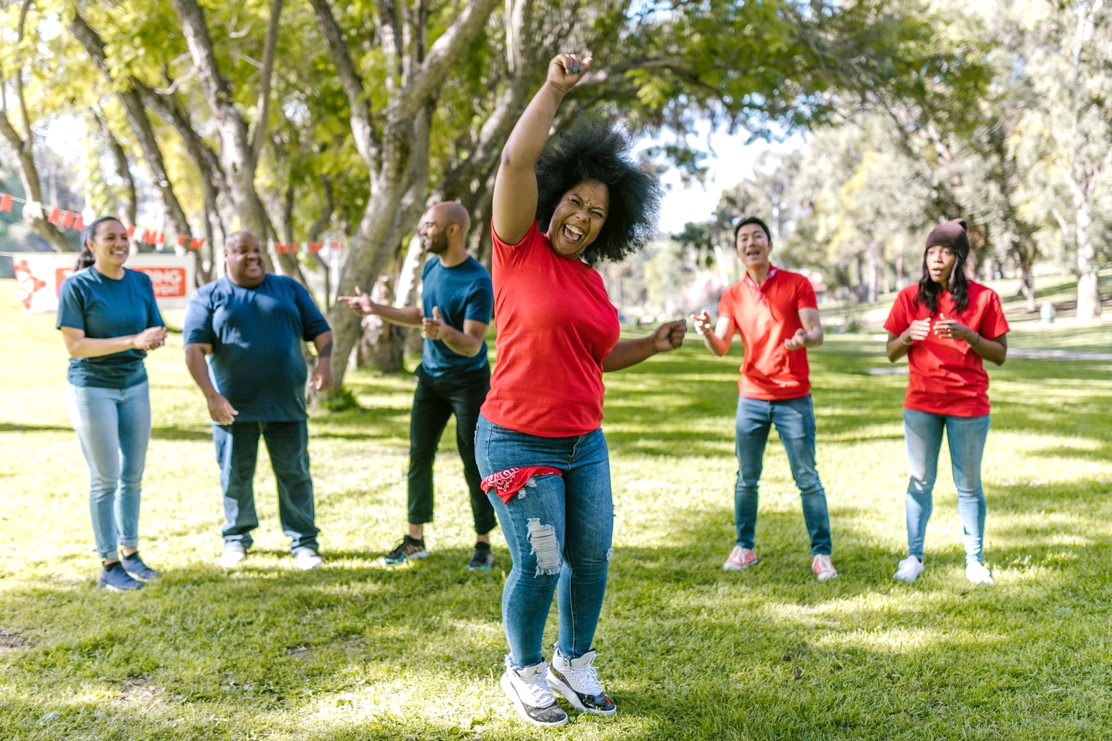Family of 3 holding hands and jumping together